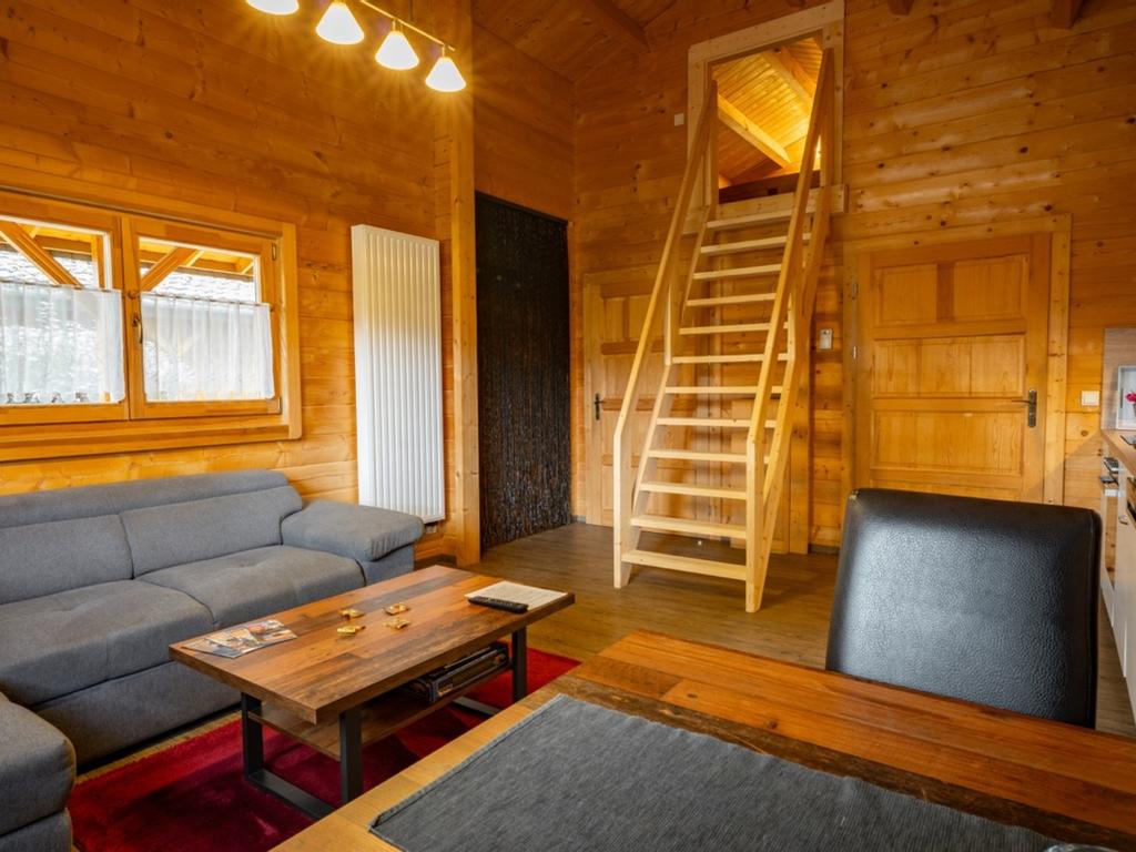 Living area with stairs leading to the loft