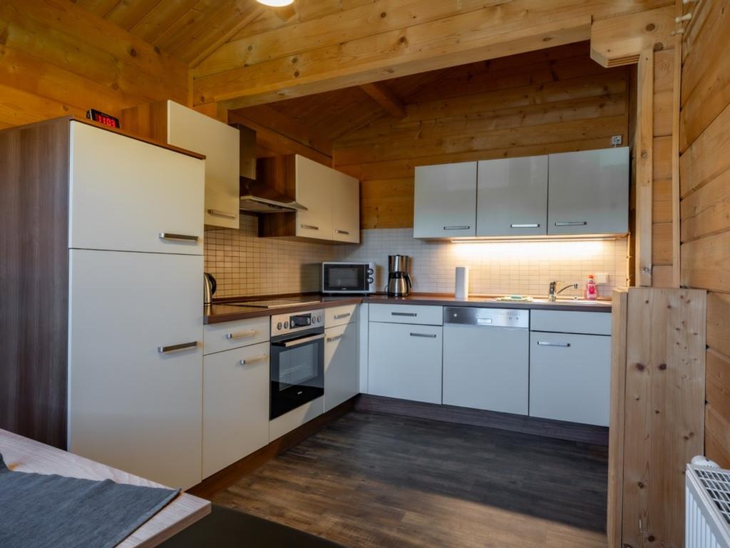 Fitted kitchen with dining area
