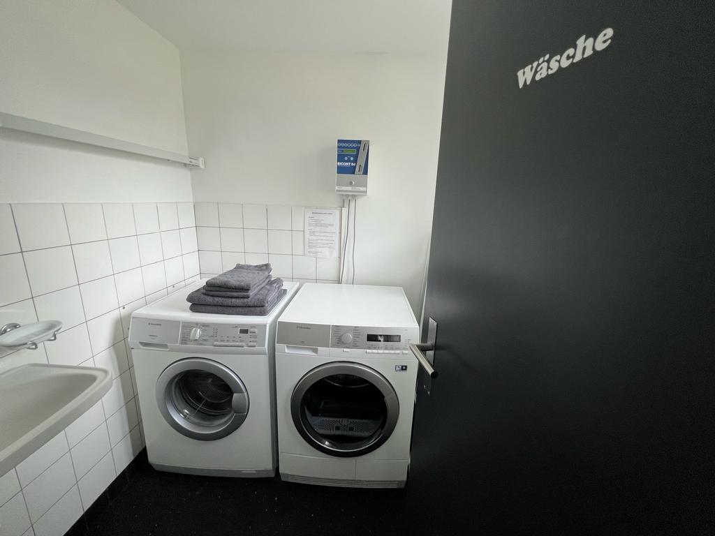 Washing machine and dryer available for shared use for a fee